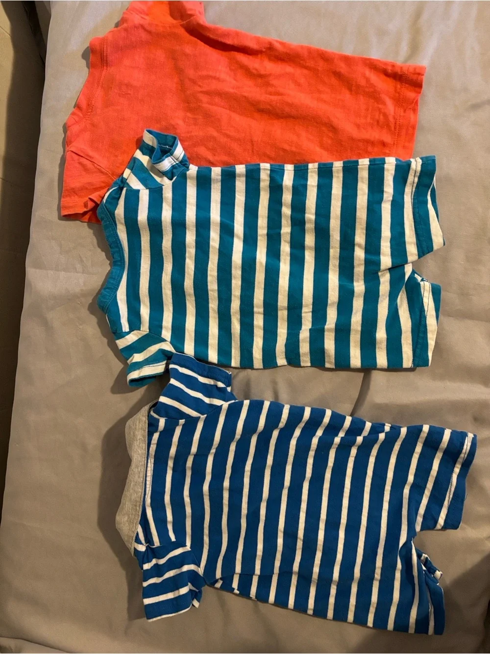 Three rompers in different brands. All size 3 months.